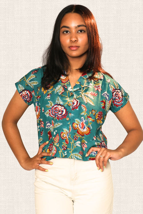 Close-up of the breathable cambric cotton fabric on the Garden Grace Teal Top.