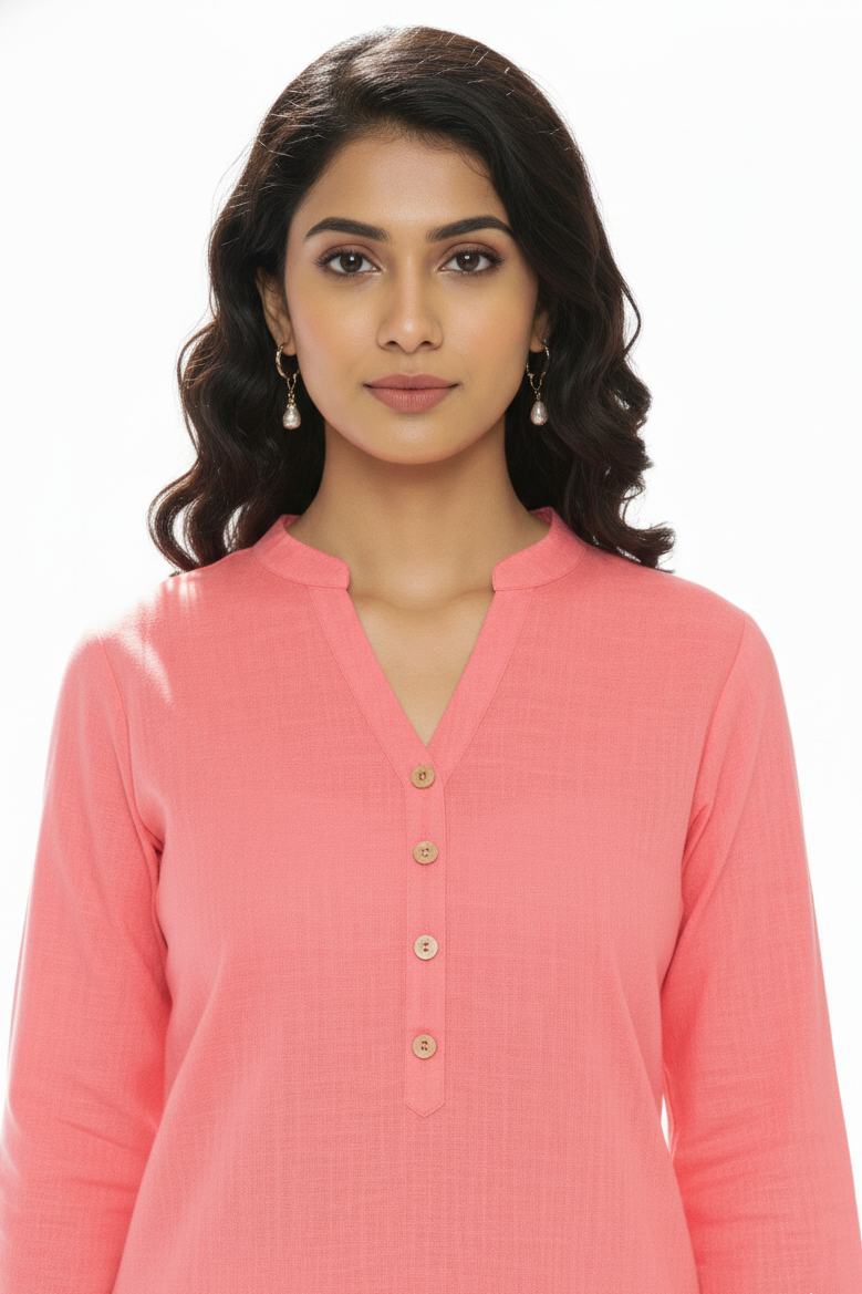 Woman wearing a pink kurta with a white background